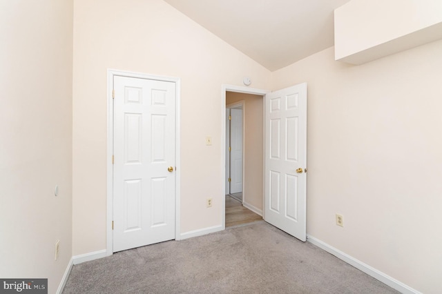 6905 Victoria Dr Unit 6905-L, Alexandria, VA 22310 - unfurnished bedroom featuring carpet and vaulted ceiling