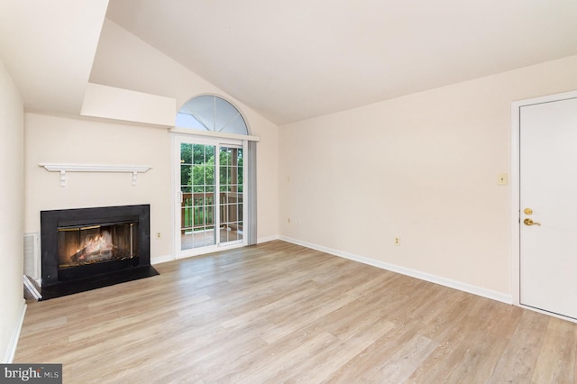 6905 Victoria Dr Unit 6905-L, Alexandria, VA 22310 - unfurnished living room with wood finished floors, a fireplace with flush hearth, and high vaulted ceiling