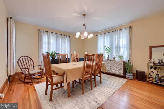76 N Grant St, Manheim, PA 17545 - dining area featuring healthy amount of natural light, a chandelier, and light wood-type flooring