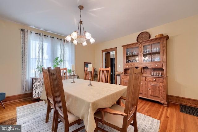 76 N Grant St, Manheim, PA 17545 - dining space featuring a chandelier and light wood finished floors
