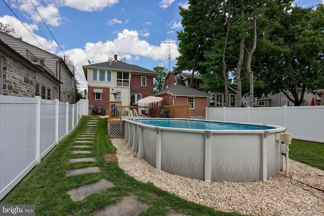 76 N Grant St, Manheim, PA 17545 - view of swimming pool featuring a fenced backyard and a deck
