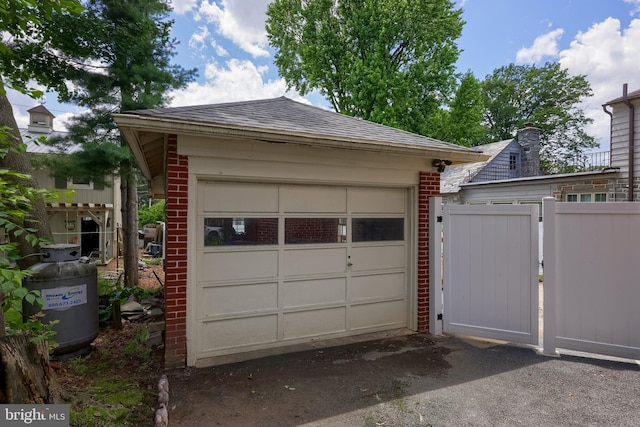76 N Grant St, Manheim, PA 17545 - garage featuring a gate and asphalt driveway