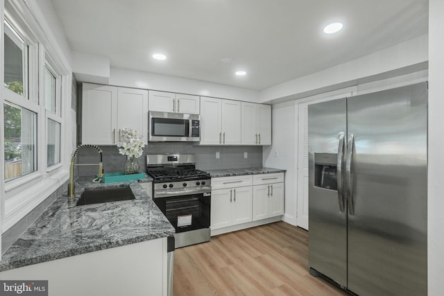 1700 Melbourne Rd, Baltimore, MD 21222 - kitchen with stainless steel appliances, white cabinetry, stone countertops, backsplash, and recessed lighting