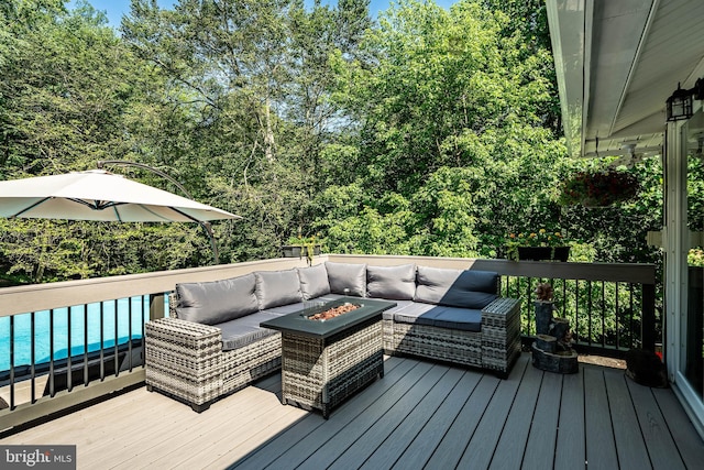 1225 Shenkel Rd, Pottstown, PA 19465 - wooden deck featuring an outdoor living space with a fire pit and a pool