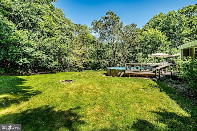 1225 Shenkel Rd, Pottstown, PA 19465 - view of green lawn featuring a wooden deck and a view of trees