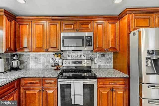 1225 Shenkel Rd, Pottstown, PA 19465 - kitchen featuring stainless steel appliances, tasteful backsplash, and light stone countertops