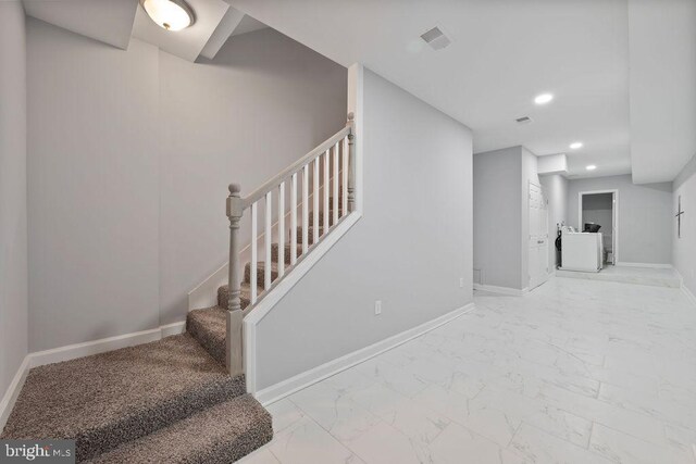 1815 N Warwick Ave, Baltimore, MD 21216 - stairway featuring marble look tiles and recessed lighting