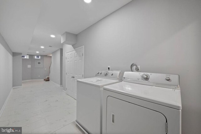 1815 N Warwick Ave, Baltimore, MD 21216 - washroom featuring washer and dryer, recessed lighting, and light marble finish flooring