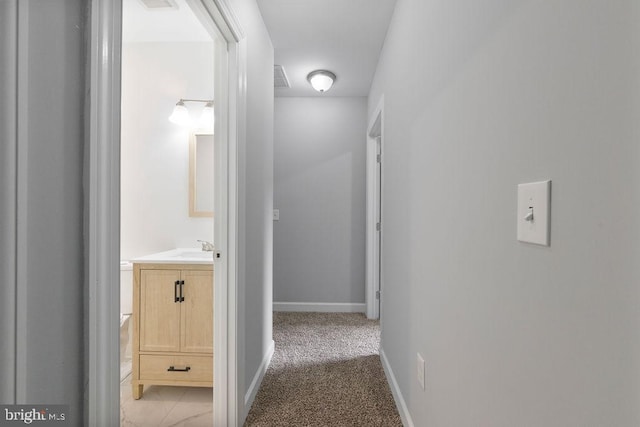 1815 N Warwick Ave, Baltimore, MD 21216 - hall with baseboards and light carpet