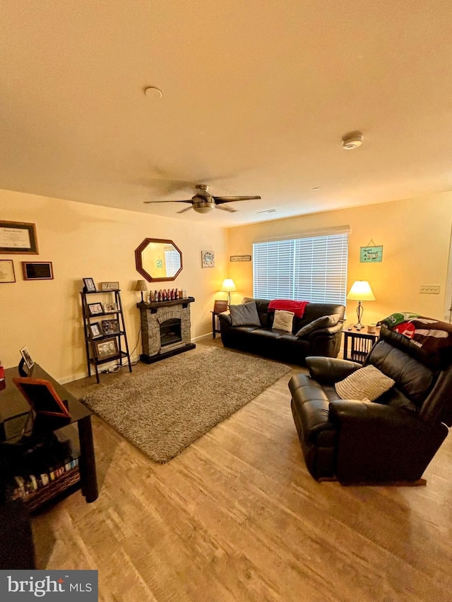 732 Farmwood Ln, Lebanon, PA 17042 - living room featuring ceiling fan, wood finished floors, and a stone fireplace