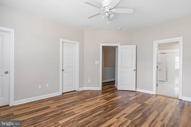2 Smithfield Ct Unit 8, Ocean View, DE 19970 - unfurnished bedroom with wood finished floors, ensuite bathroom, and ceiling fan