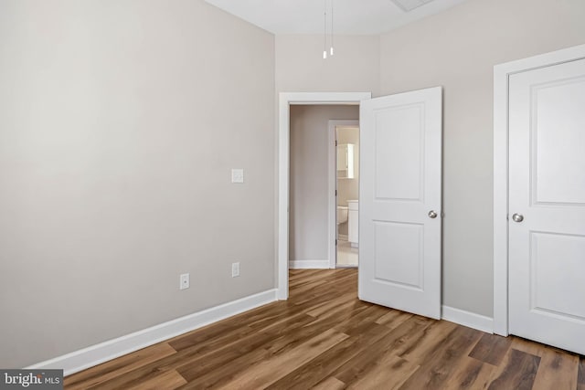 2 Smithfield Ct Unit 8, Ocean View, DE 19970 - unfurnished bedroom with baseboards and wood finished floors