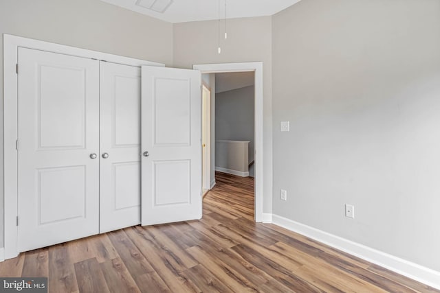 2 Smithfield Ct Unit 8, Ocean View, DE 19970 - unfurnished bedroom with a closet and wood finished floors