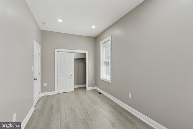 2419 Arlington St, Philadelphia, PA 19121 - unfurnished bedroom with light wood finished floors, recessed lighting, and a closet