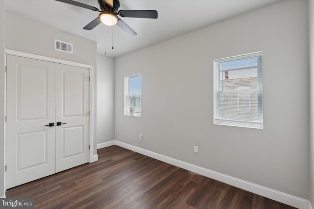 2419 Arlington St, Philadelphia, PA 19121 - unfurnished bedroom with dark wood finished floors, a closet, and a ceiling fan