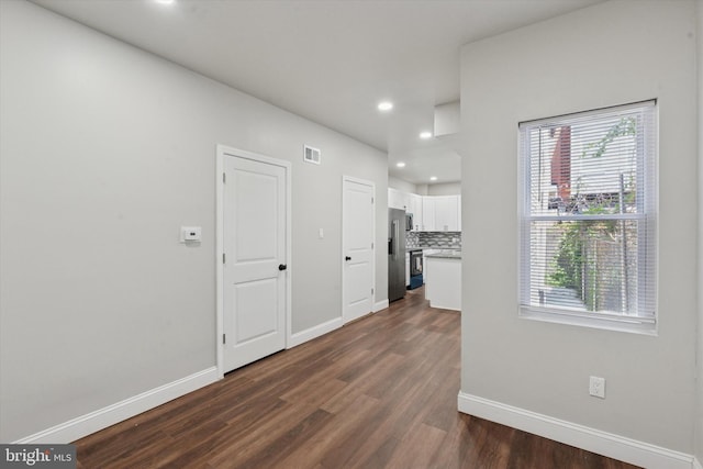 2419 Arlington St, Philadelphia, PA 19121 - unfurnished living room with dark wood-type flooring, recessed lighting, and healthy amount of natural light
