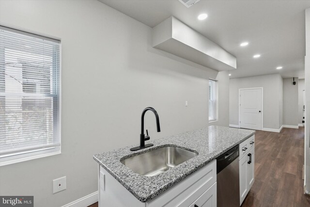 2419 Arlington St, Philadelphia, PA 19121 - kitchen with stainless steel dishwasher, white cabinets, dark wood-type flooring, light stone countertops, and recessed lighting