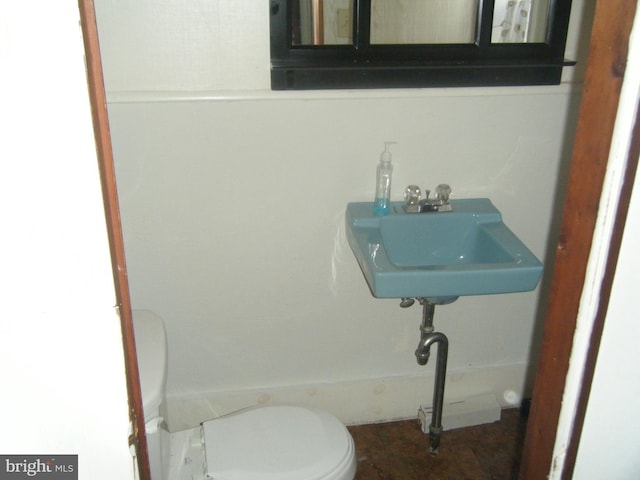 213 S 58th St, Philadelphia, PA 19139 - half bathroom with toilet and a sink