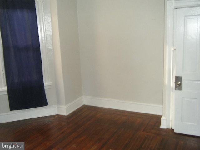 213 S 58th St, Philadelphia, PA 19139 - unfurnished room with baseboards and dark wood-type flooring