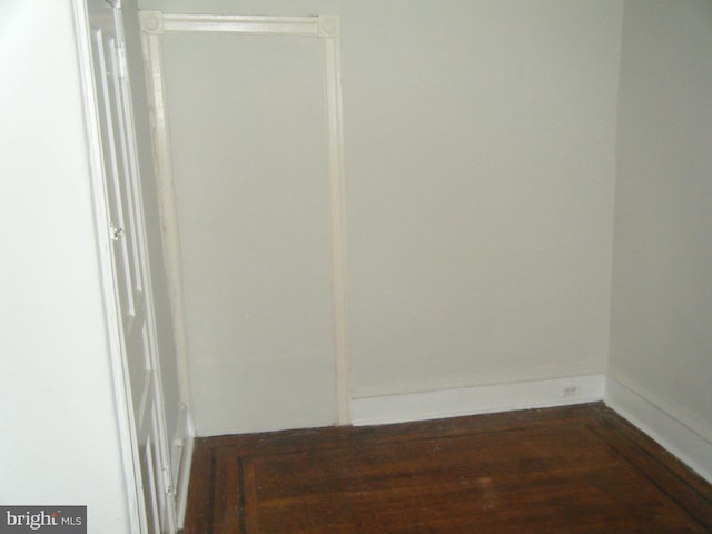 213 S 58th St, Philadelphia, PA 19139 - spare room with dark wood-style flooring and baseboards