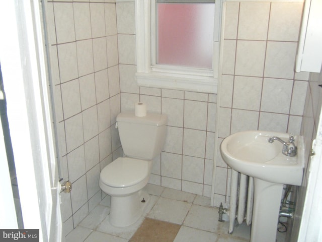 213 S 58th St, Philadelphia, PA 19139 - half bath with tile walls and tile patterned flooring
