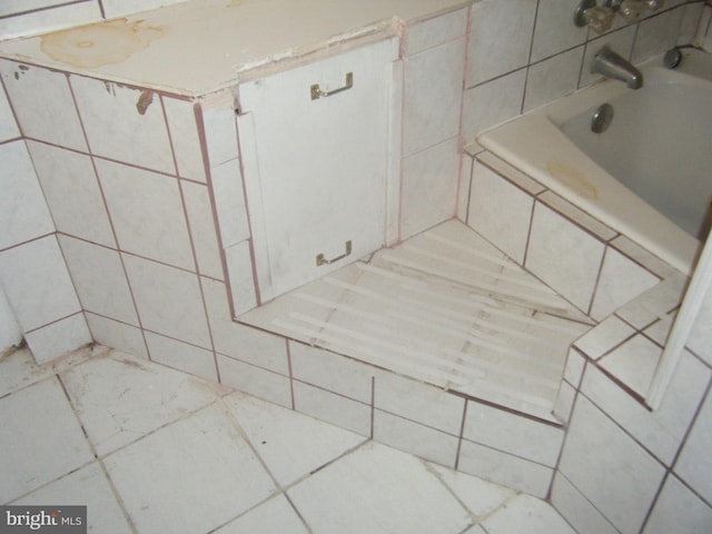 213 S 58th St, Philadelphia, PA 19139 - bathroom featuring tiled tub and a shower