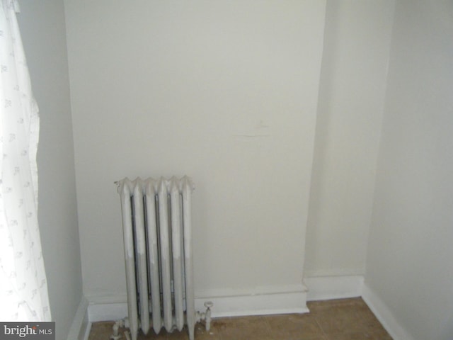 213 S 58th St, Philadelphia, PA 19139 - detailed view of radiator and baseboards