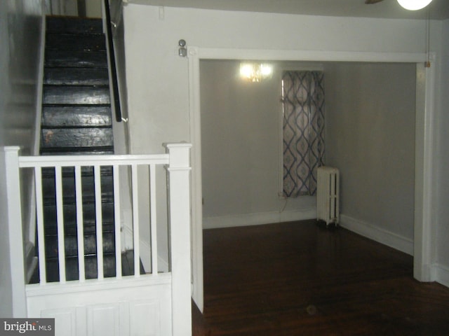 213 S 58th St, Philadelphia, PA 19139 - staircase featuring radiator heating unit, wood finished floors, and a ceiling fan