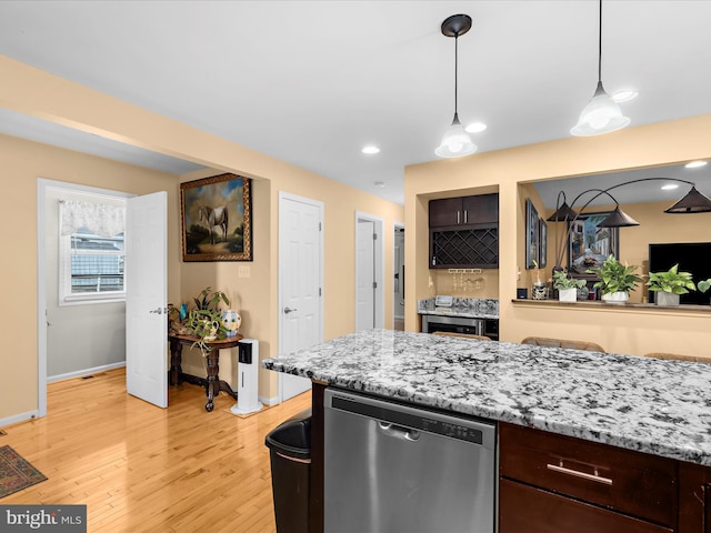 1811 Hilltop Ave, Baltimore, MD 21221 - kitchen featuring dishwasher, light wood-type flooring, dark brown cabinetry, hanging light fixtures, and light stone counters