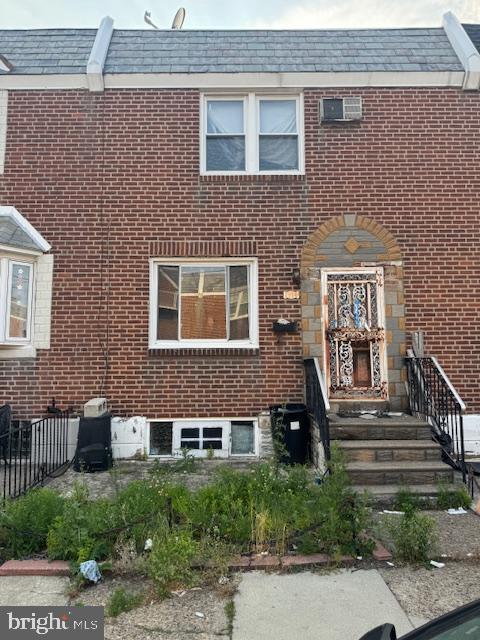 1814 S Newkirk St, Philadelphia, PA 19145 - view of front of house with brick siding and a high end roof
