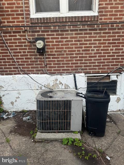 1814 S Newkirk St, Philadelphia, PA 19145 - exterior view of a central air condition unit and brick siding
