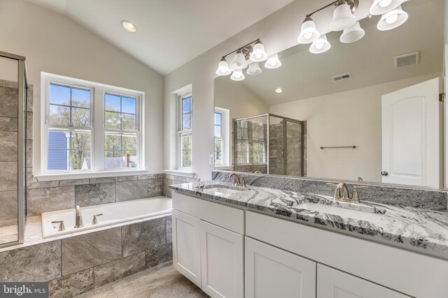 806 Pengrove Ct Lot 54, Bowie, MD 20716 - bathroom with vaulted ceiling, double vanity, a bath, a tile shower, and a chandelier