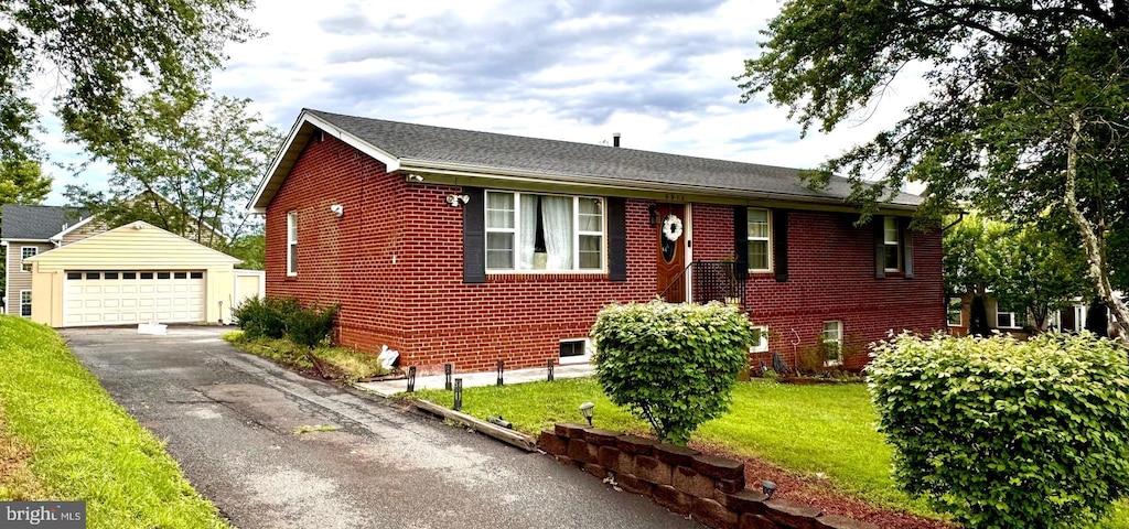9912 S Grant Ave, Manassas, VA 20110 - ranch-style home featuring an outdoor structure, a detached garage, brick siding, and a front yard