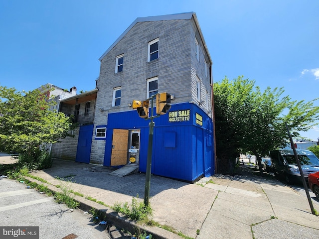 101 S Payson St, Baltimore, MD 21223 - view of side of home with stone siding