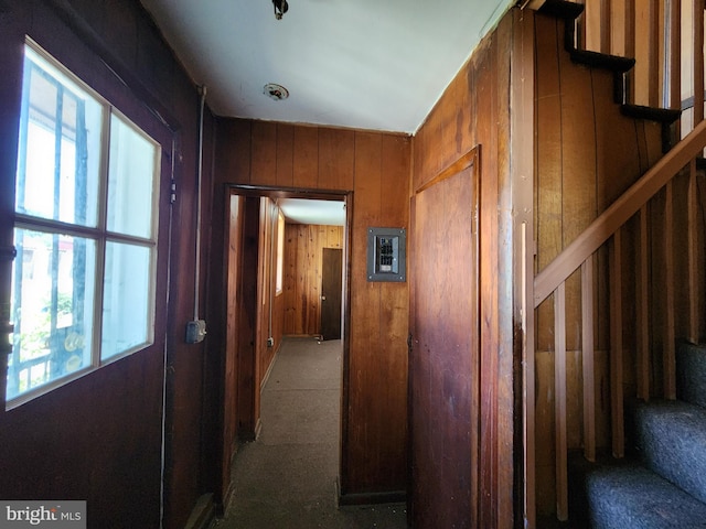 101 S Payson St, Baltimore, MD 21223 - hallway with stairway, carpet floors, and wooden walls