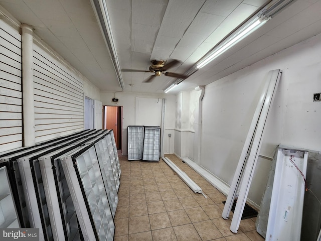 101 S Payson St, Baltimore, MD 21223 - below grade area featuring ceiling fan and light tile patterned floors