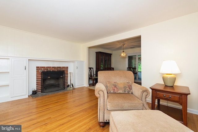 245 Greentree Dr, West Chester, PA 19382 - living area with light wood-style flooring and a fireplace