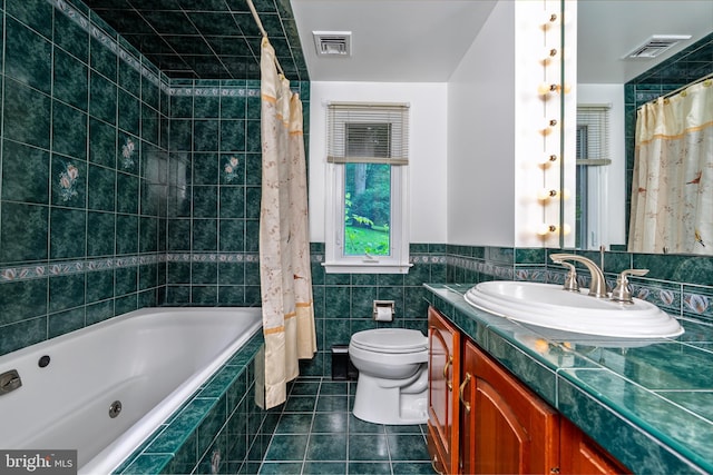 245 Greentree Dr, West Chester, PA 19382 - full bathroom featuring vanity, tile patterned floors, tiled shower / bath, tile walls, and wainscoting