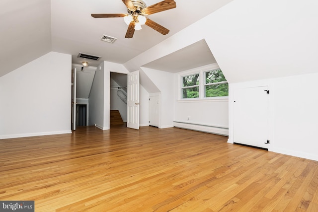 245 Greentree Dr, West Chester, PA 19382 - bonus room with a baseboard heating unit, light wood-style floors, ceiling fan, and vaulted ceiling