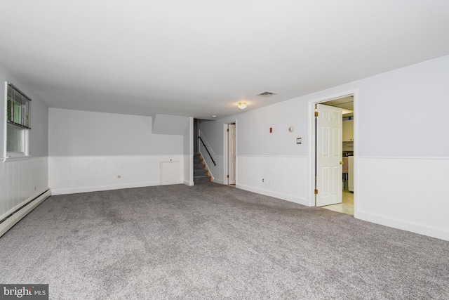 245 Greentree Dr, West Chester, PA 19382 - unfurnished room with stairway, a wainscoted wall, carpet flooring, and a baseboard heating unit