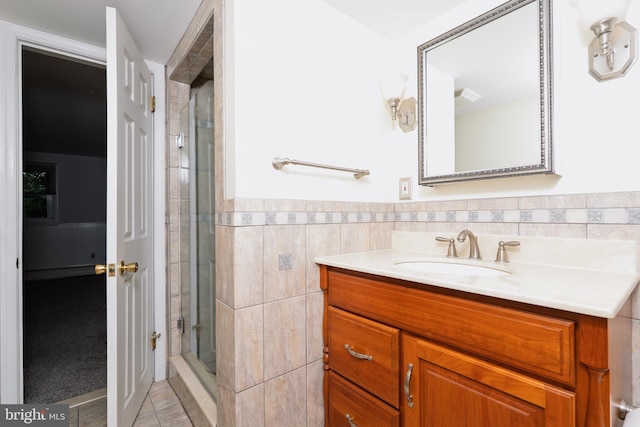 245 Greentree Dr, West Chester, PA 19382 - full bath featuring vanity, a shower stall, tile walls, tile patterned flooring, and wainscoting