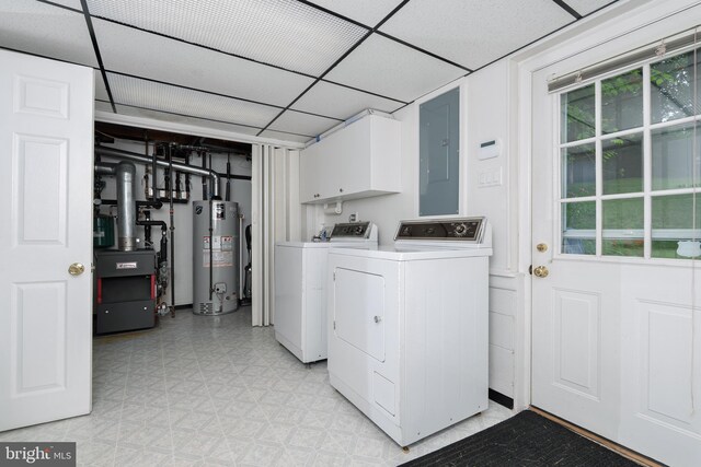 245 Greentree Dr, West Chester, PA 19382 - laundry area with gas water heater, cabinet space, light flooring, washer and clothes dryer, and electric panel