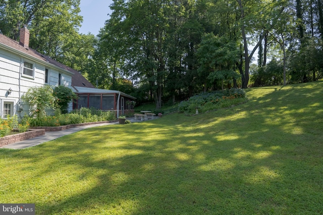 245 Greentree Dr, West Chester, PA 19382 - view of green lawn with a sunroom and view of wooded area