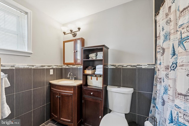 1639 S 19th St, Philadelphia, PA 19145 - full bath featuring tile walls, vanity, wainscoting, and a shower with shower curtain