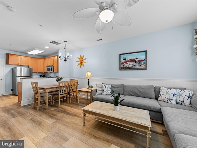 106 69th St Unit 13D, Ocean City, MD 21842 - living room with a chandelier, light wood-style flooring, a ceiling fan, a wainscoted wall, and recessed lighting