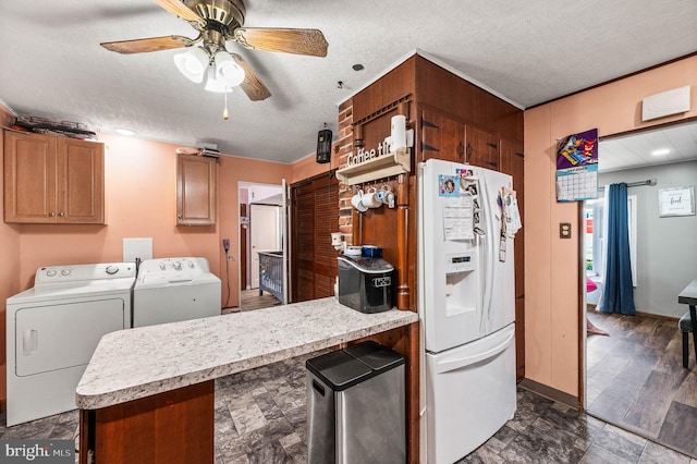 672 Austin Dr, Fairless Hills, PA 19030 - kitchen with white fridge with ice dispenser, separate washer and dryer, light countertops, a peninsula, and a textured ceiling