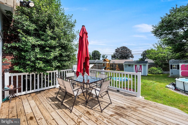 672 Austin Dr, Fairless Hills, PA 19030 - wooden deck featuring a shed, outdoor dining area, and a fenced backyard