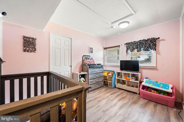 672 Austin Dr, Fairless Hills, PA 19030 - bedroom featuring attic access, crown molding, and wood finished floors