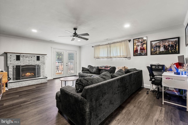 672 Austin Dr, Fairless Hills, PA 19030 - living area featuring crown molding, ceiling fan, wood finished floors, recessed lighting, and a brick fireplace