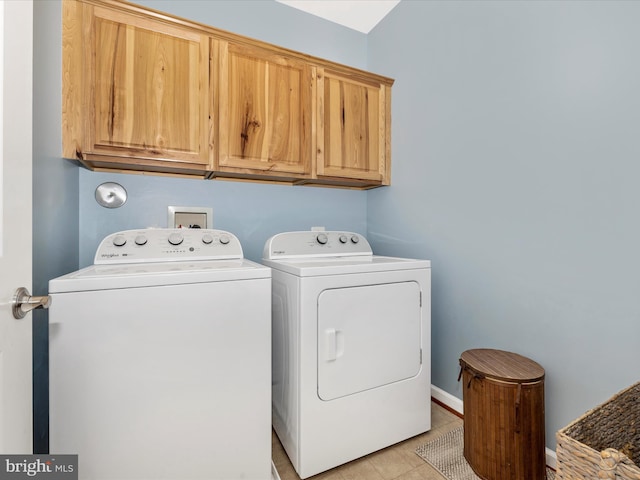 2503 Island Grove Blvd, Frederick, MD 21701 - washroom with washer and clothes dryer, cabinet space, and light tile patterned floors